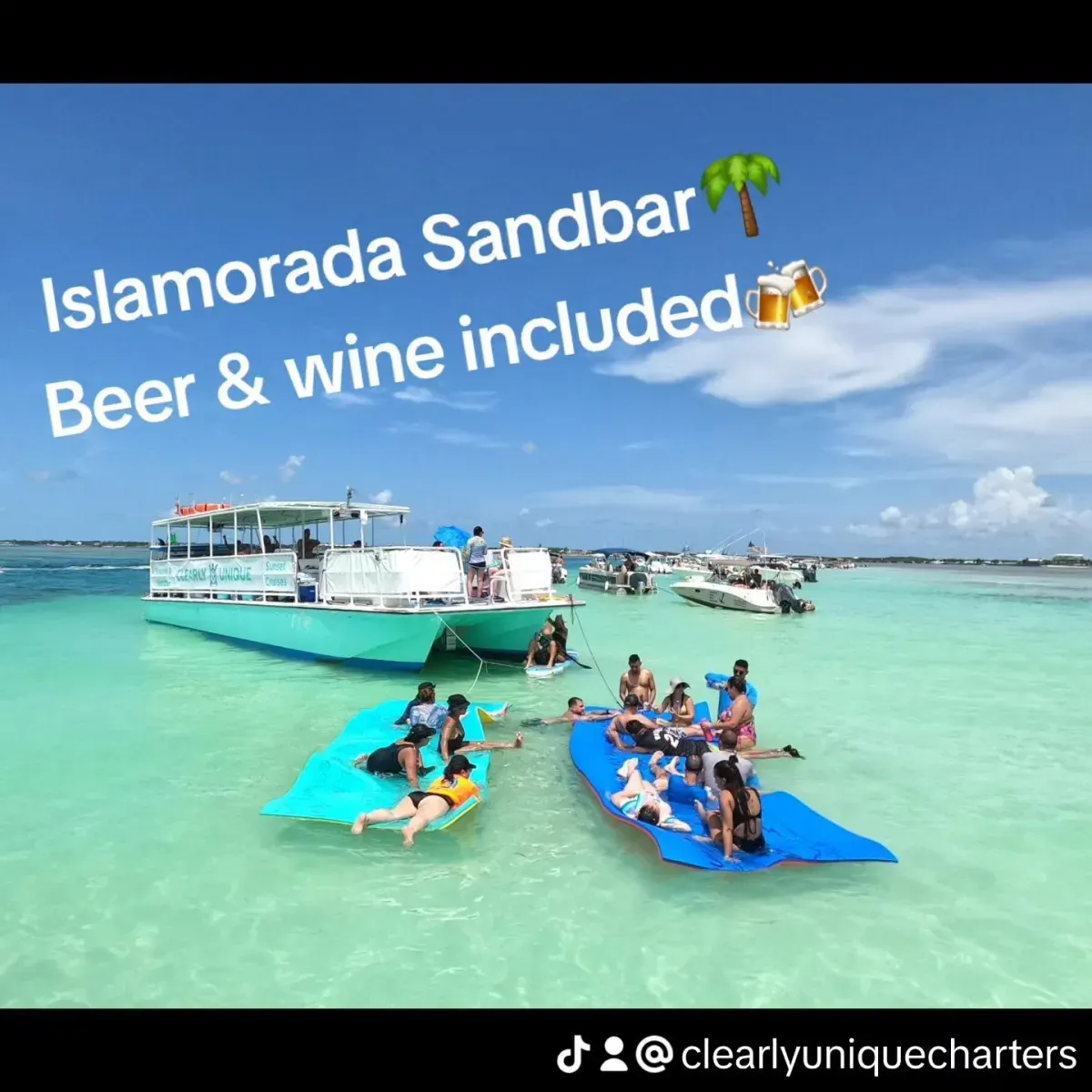 Happy guest enjoying a drink and floating on an inner tube at an Islamorada sandbar